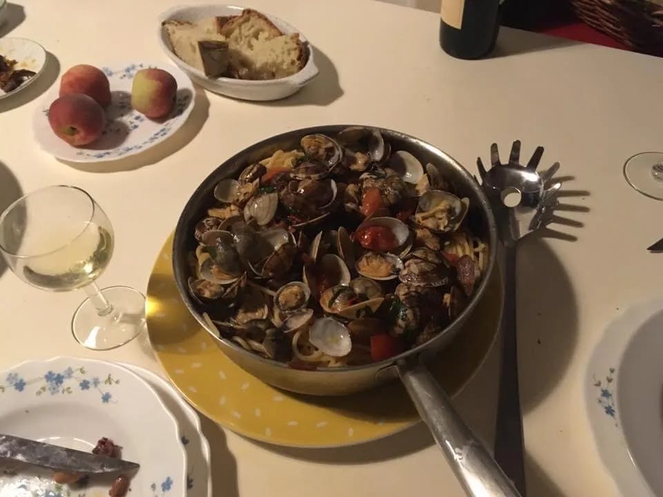 An iron pan filed with pasta