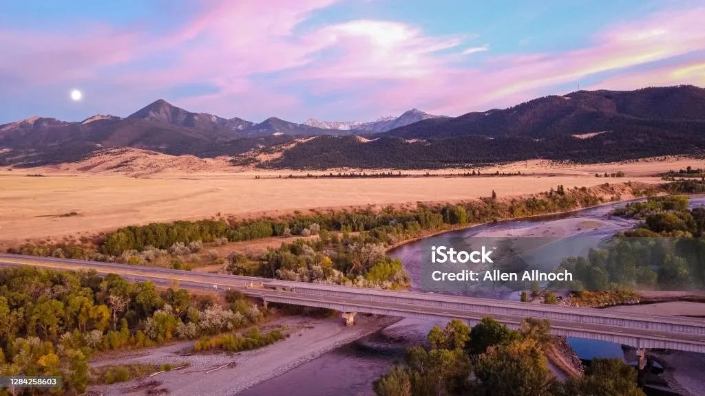 Aerial view overlooking the Yellowstone River, Interstate 90 and mountainous terrain south of Livingston, Montana.