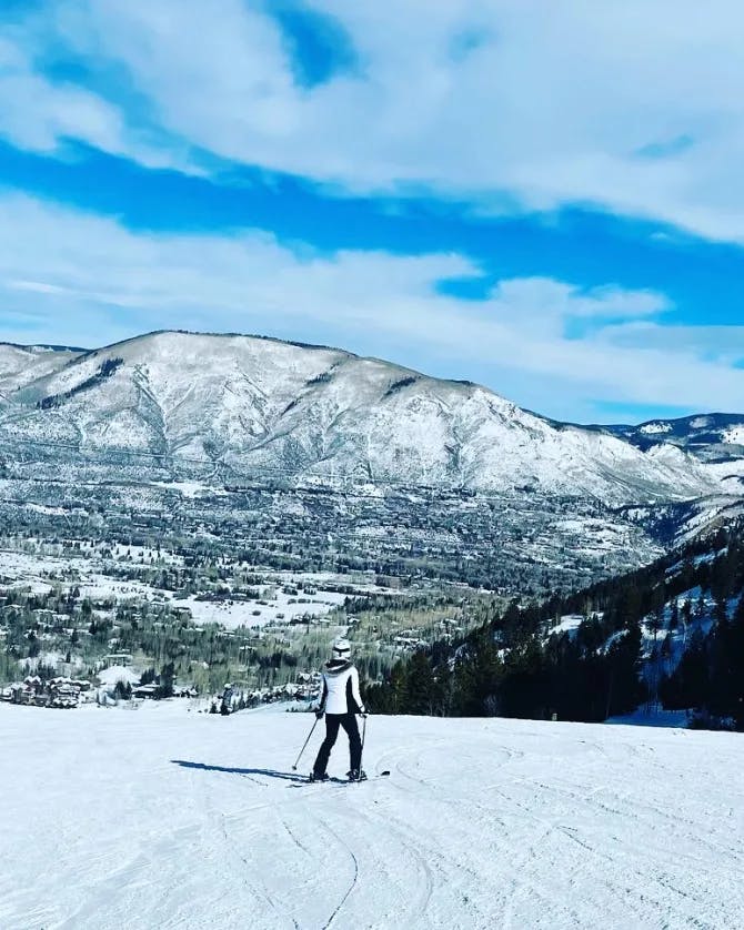 Travel advisor posing in a snowy region