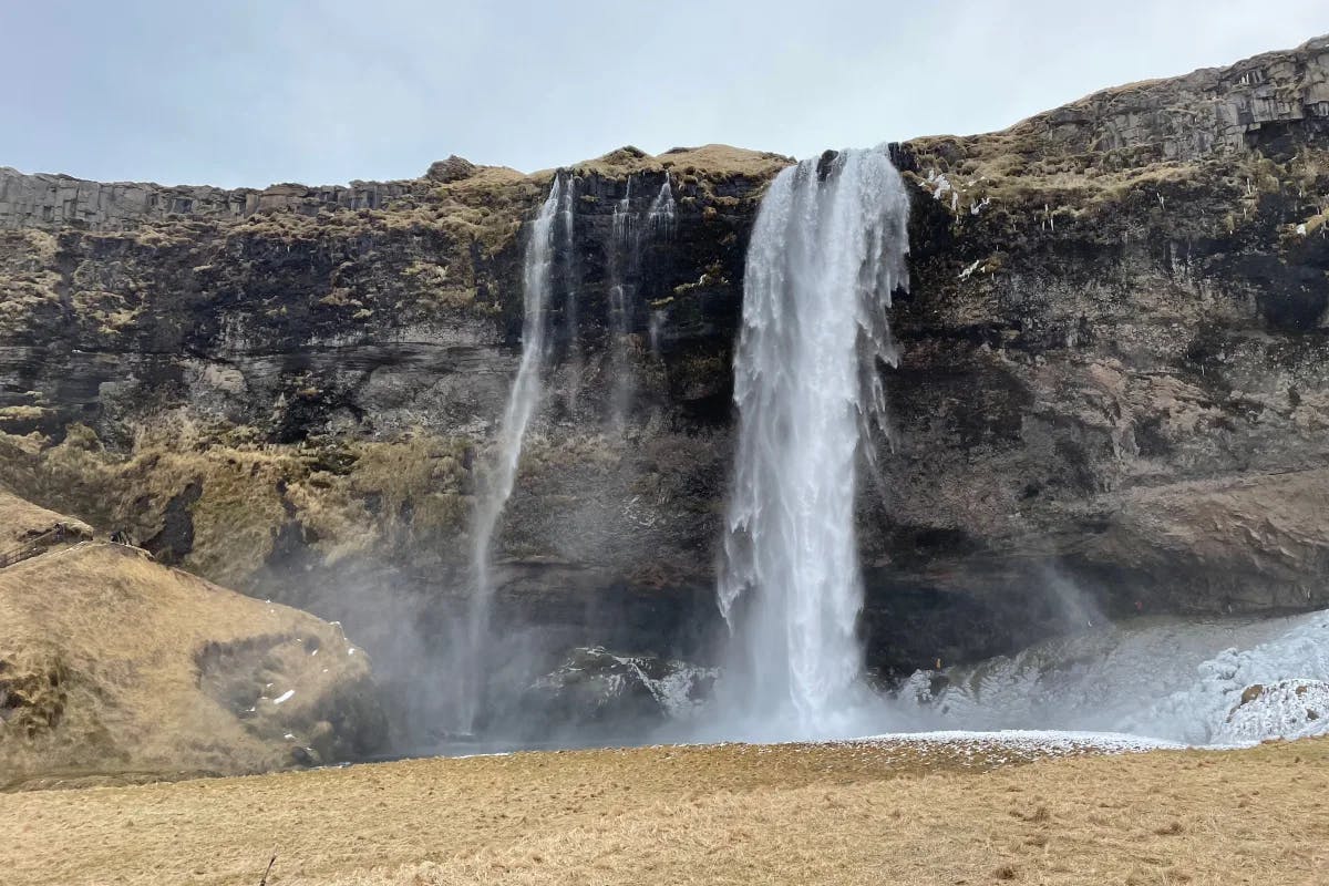 Seljalandsfoss Waterfall allows adventurous souls to walk behind the cascading curtain of water.