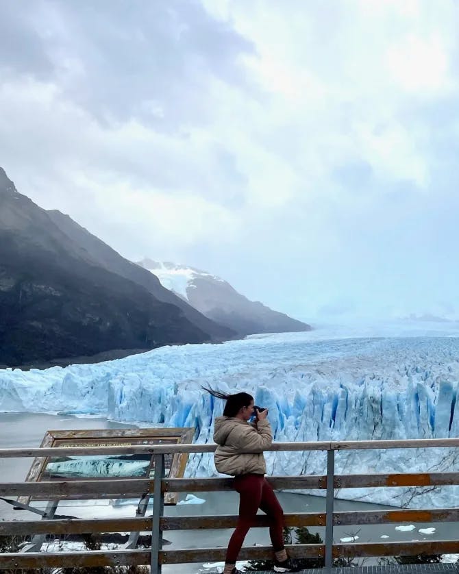 Advisor next to a frozen waterfall. 