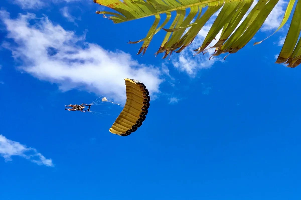 A picture of a person skydiving during daytime.