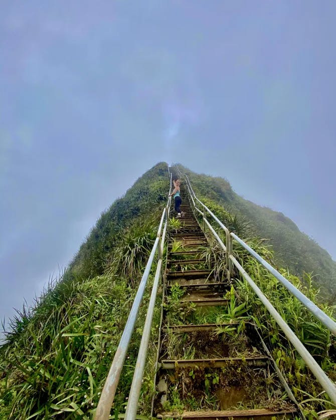 Picture of Morgan at Haiku Stairs surrounded by grass and blue sky