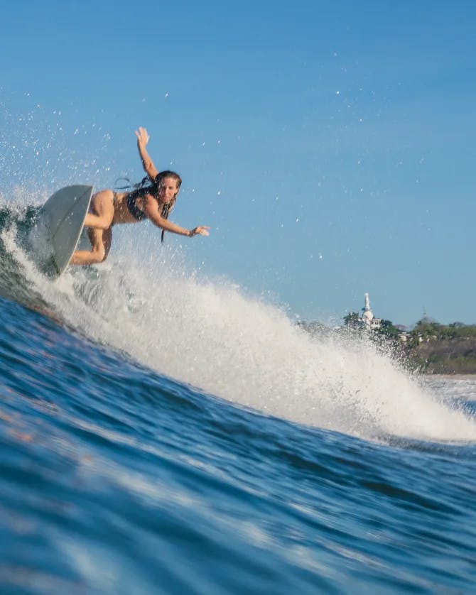 Picture of Cierra surfing