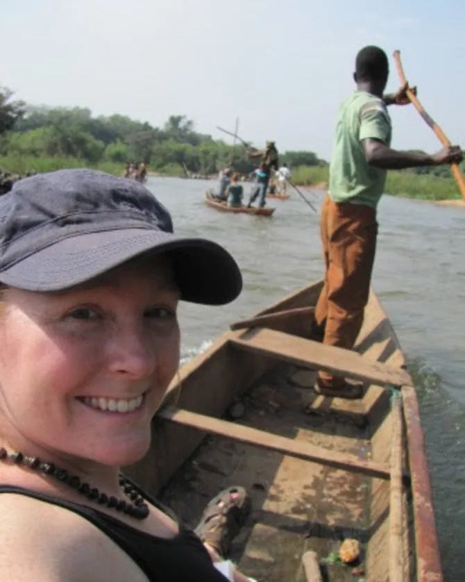 Travel advisor posing on a boat