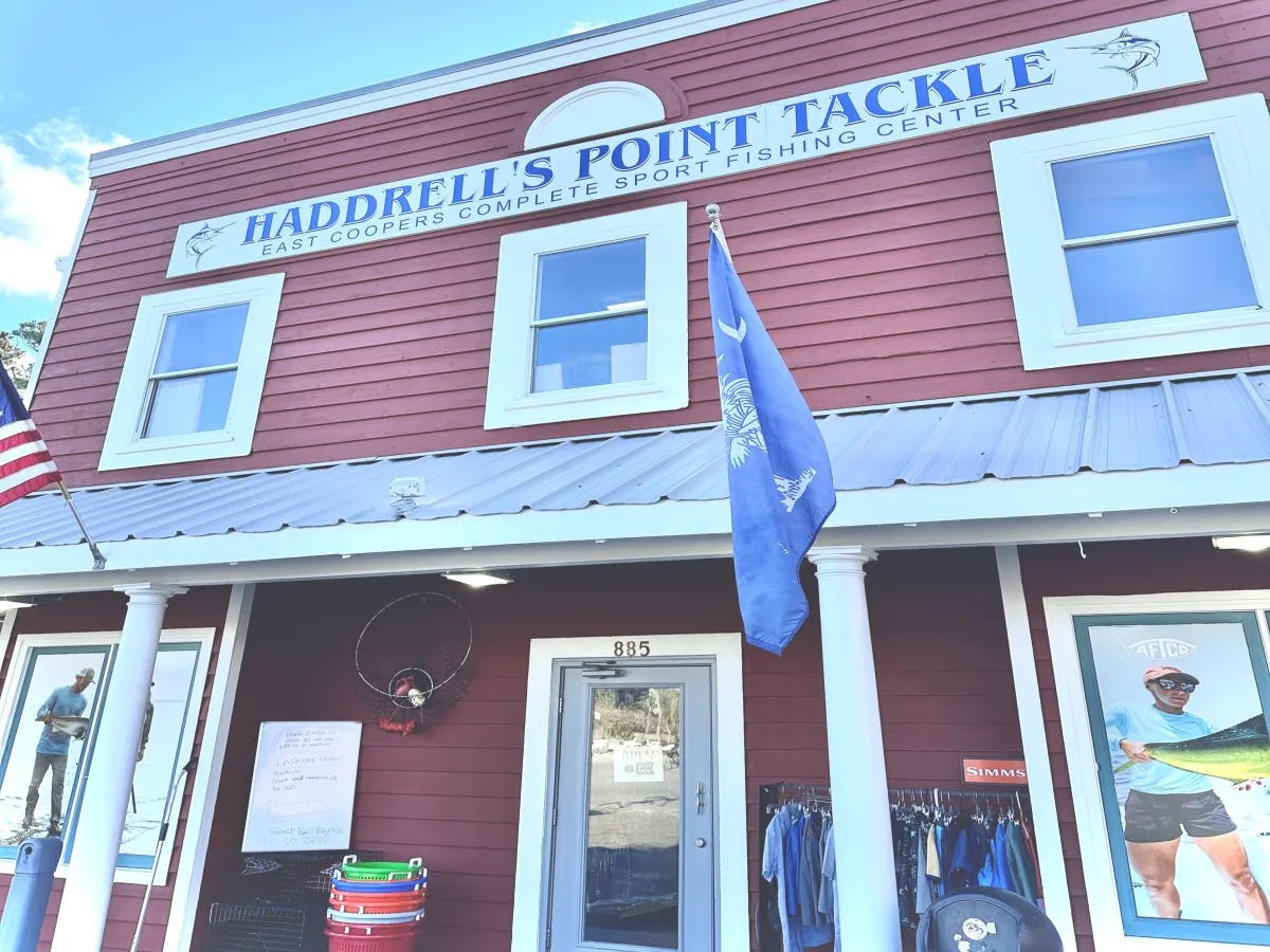 A picture of a wooden building saying Haddrell's Point Tackle.