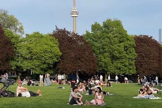 People relaxing at Trinity Bellwoods Park.