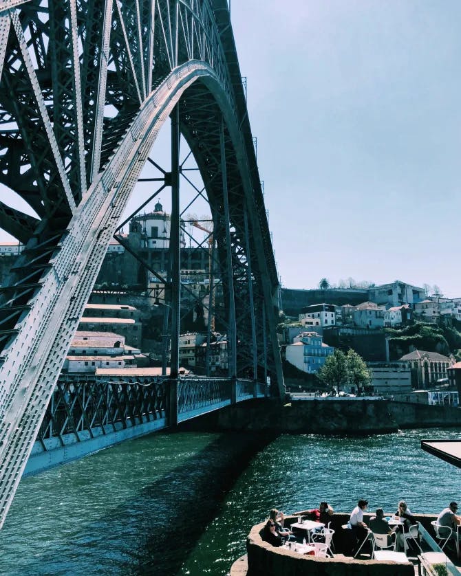 A boat crossing under the bridge