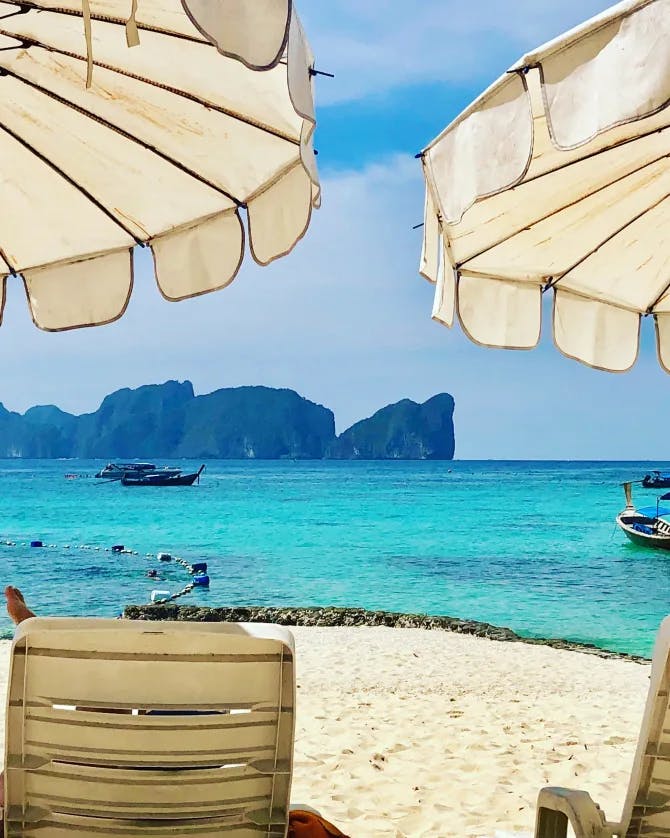 Picture of sunloungers and straw umbrellas at the beach