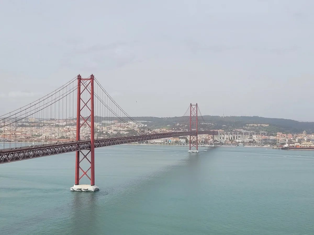 View Of Ponte 25 De Abril Bridge From Sanctuary Of Christ The King.