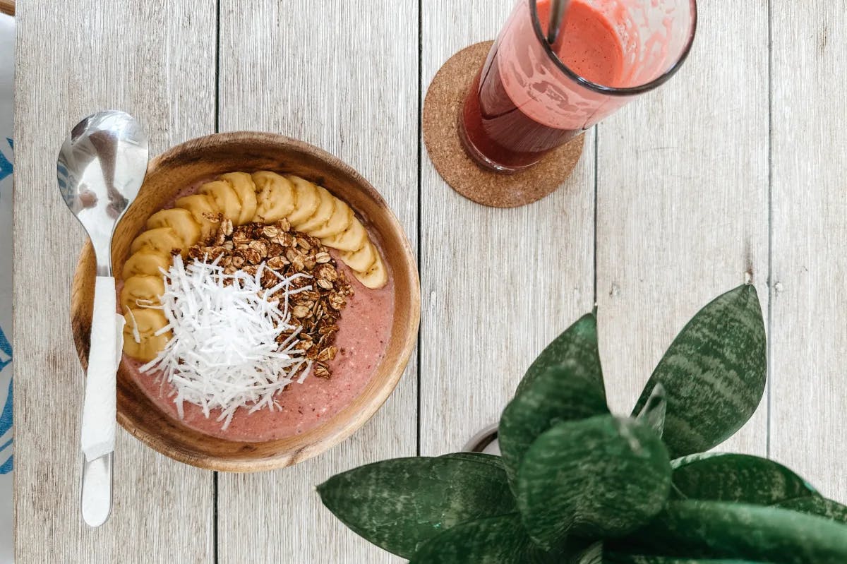 A picture of a smoothie bowl served on a table.