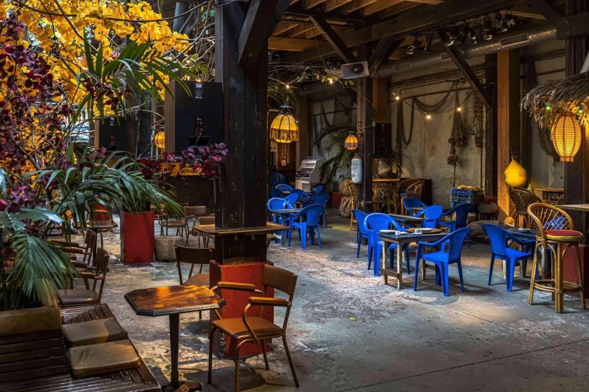 Le Comptoir Général has a rustic-chic vibe & a leafy terrace serving classic fish dishes, plus cocktails.