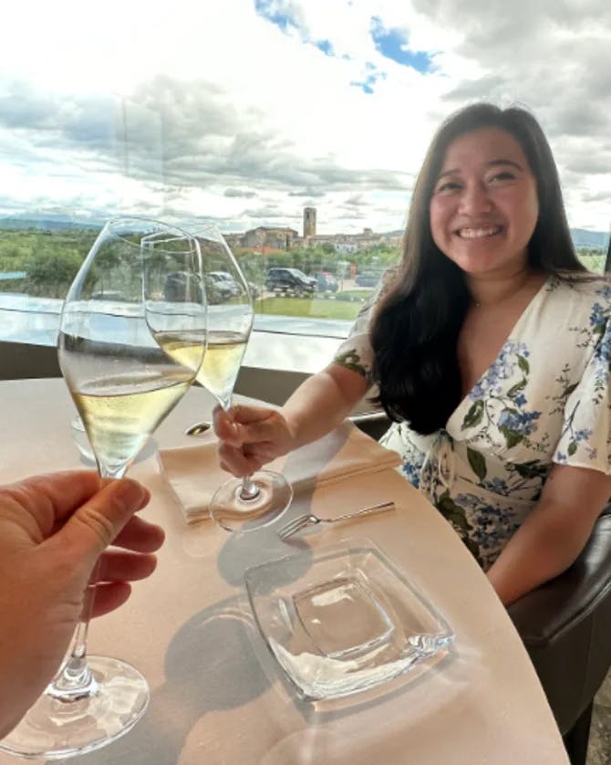 A woman cheering up with champaign