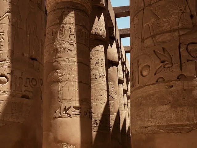 Hieroglyphs on tall stone pillars 