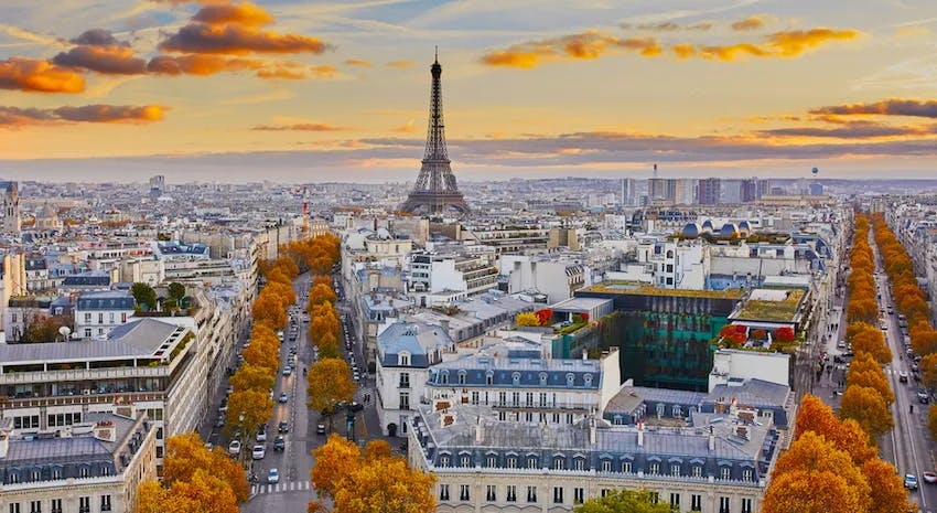 A beautiful aerial view of Paris and all the wonderful places you can visit with a gorgeous sunset and Fall colored foliage.