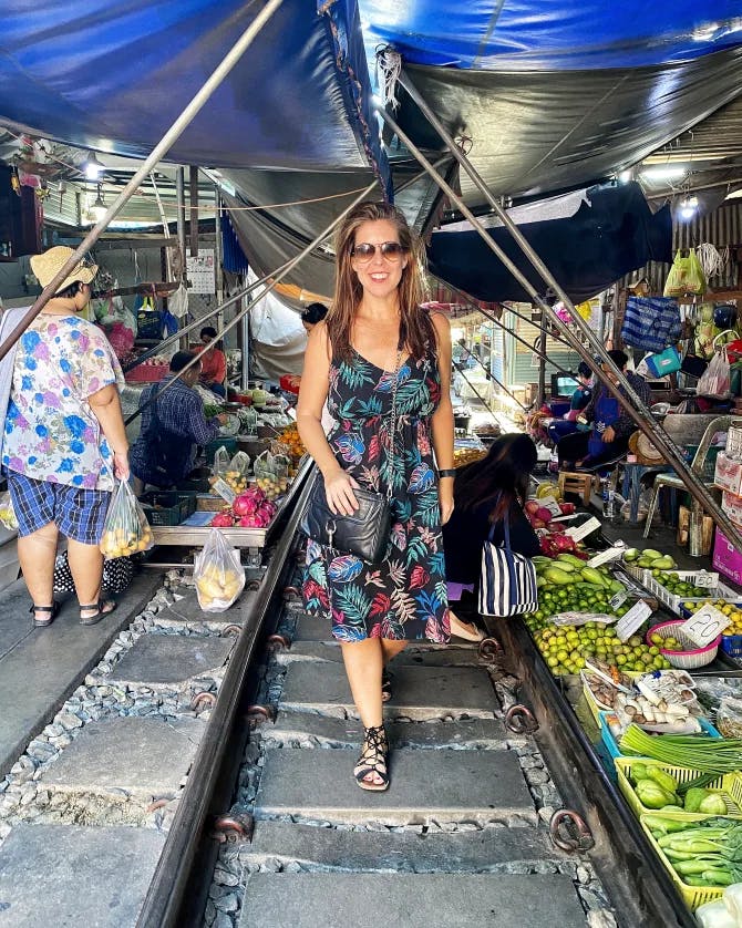 Picture of Marissa in a market with a lot of foreign goodies! 
