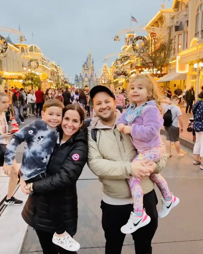 A family posing at Disneyland.