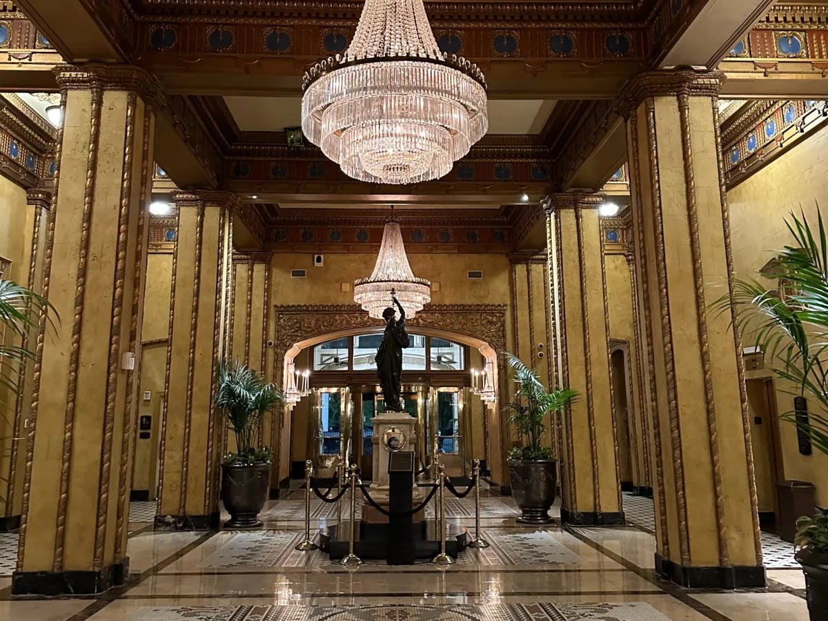 Hotel lobby with chandeliers. 