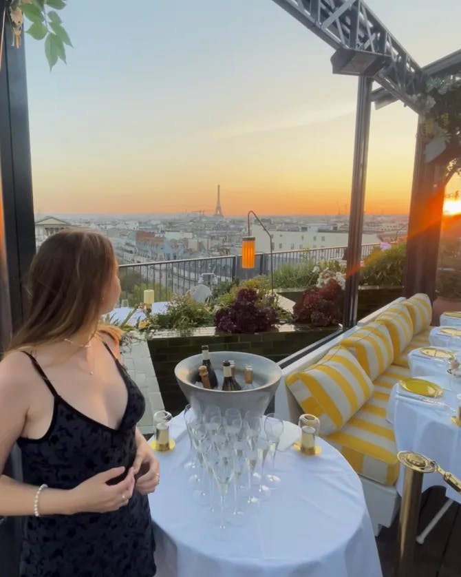 Picture of Georgia at a rooftop restaurant enjying sunset