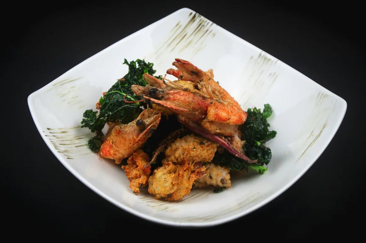 Shrimp and vegetables on a white plate.