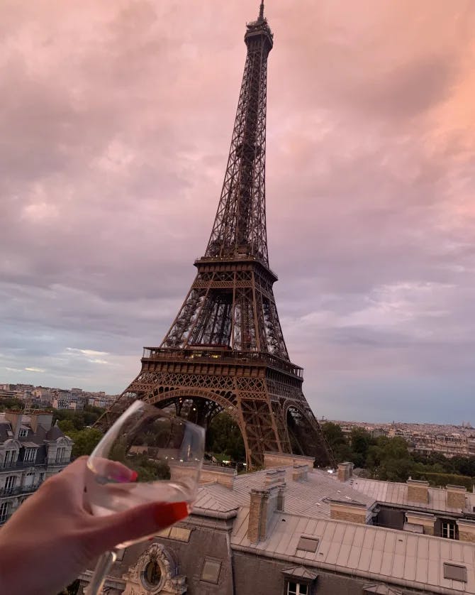 A view of the Eiffel Tower at dusk. 