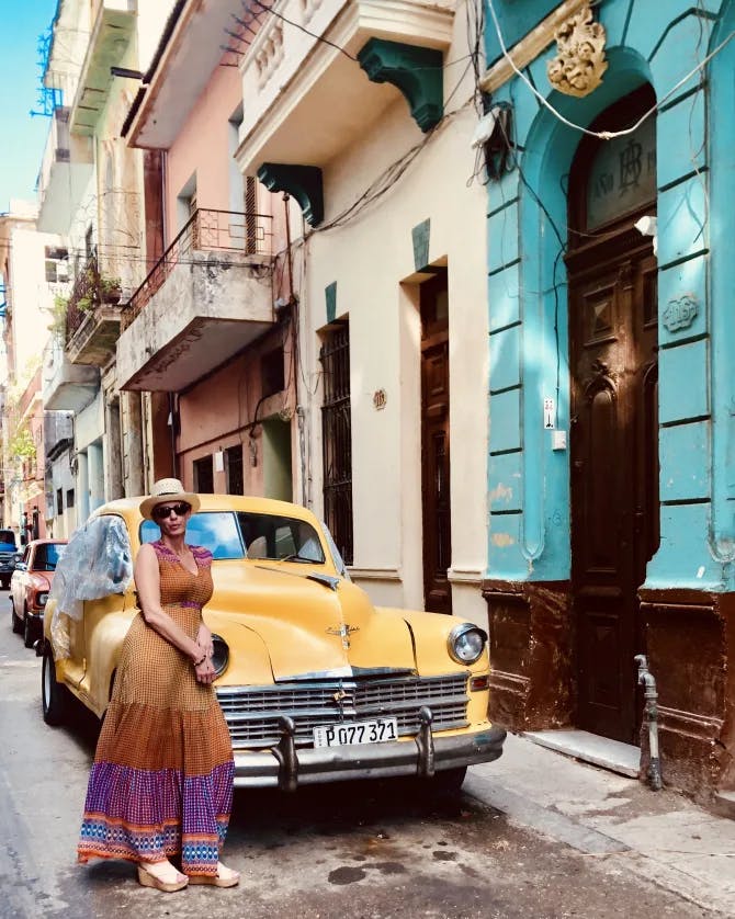 Posing with a yellow car