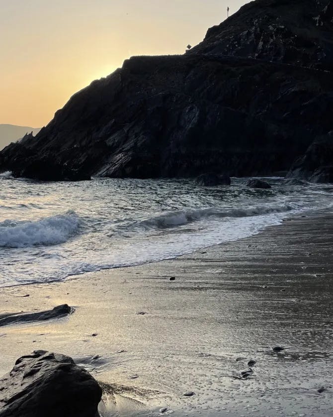 A beautiful view of beach at sunset