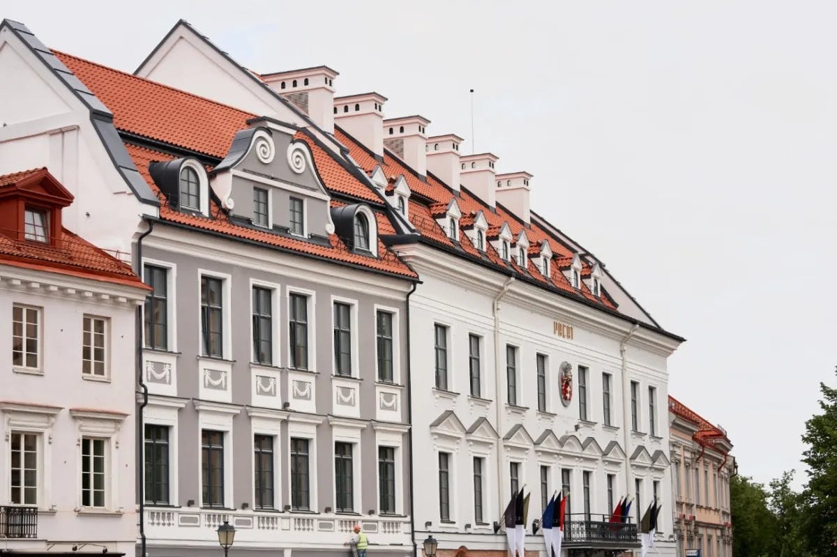 elegant white building with red tile roof