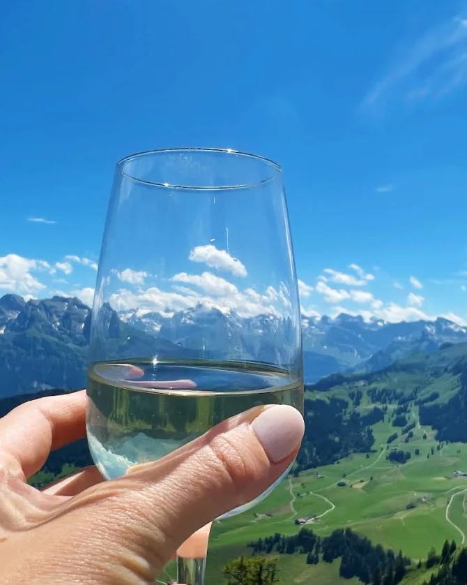 Image of a glass of drink and mountains