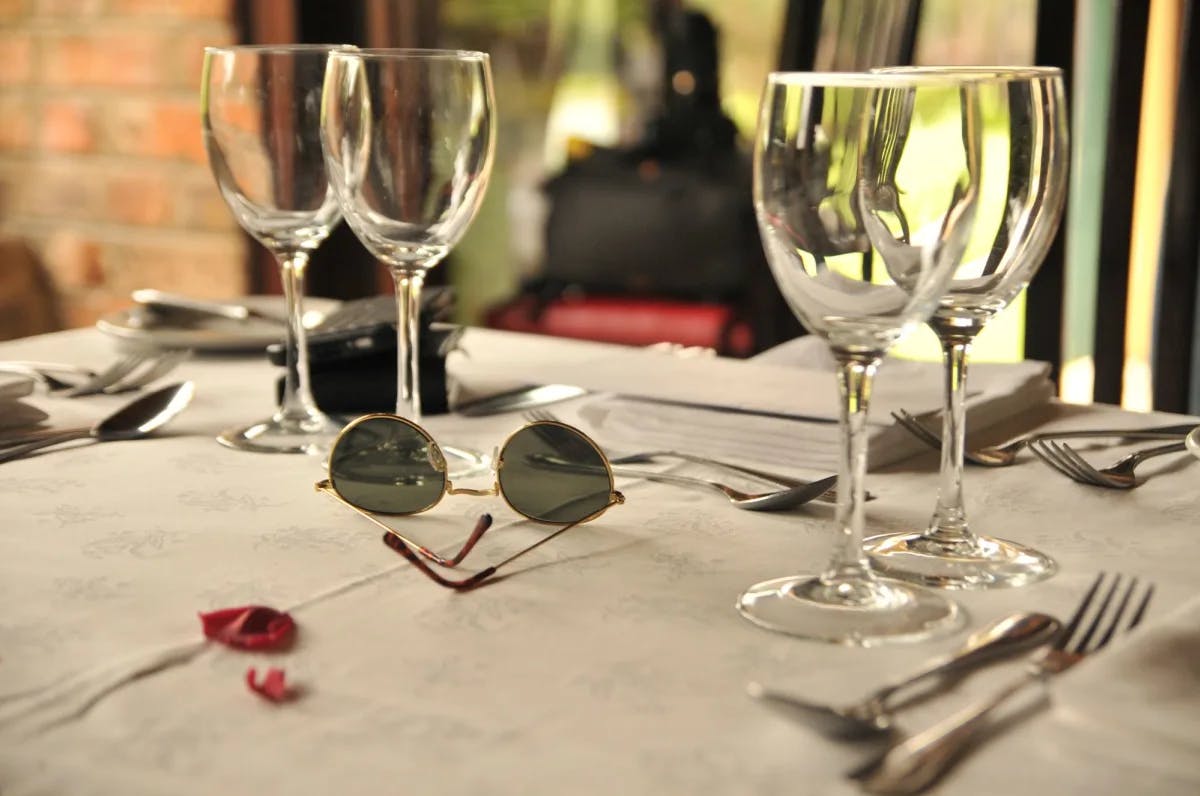 Four wine glasses on a table. 