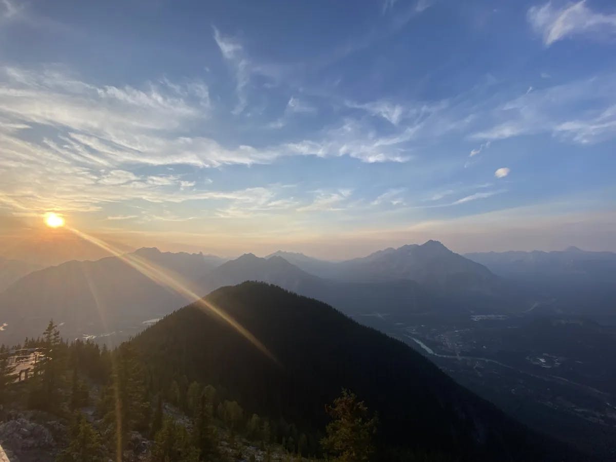 Aerial view of mountains with sun at the back. 