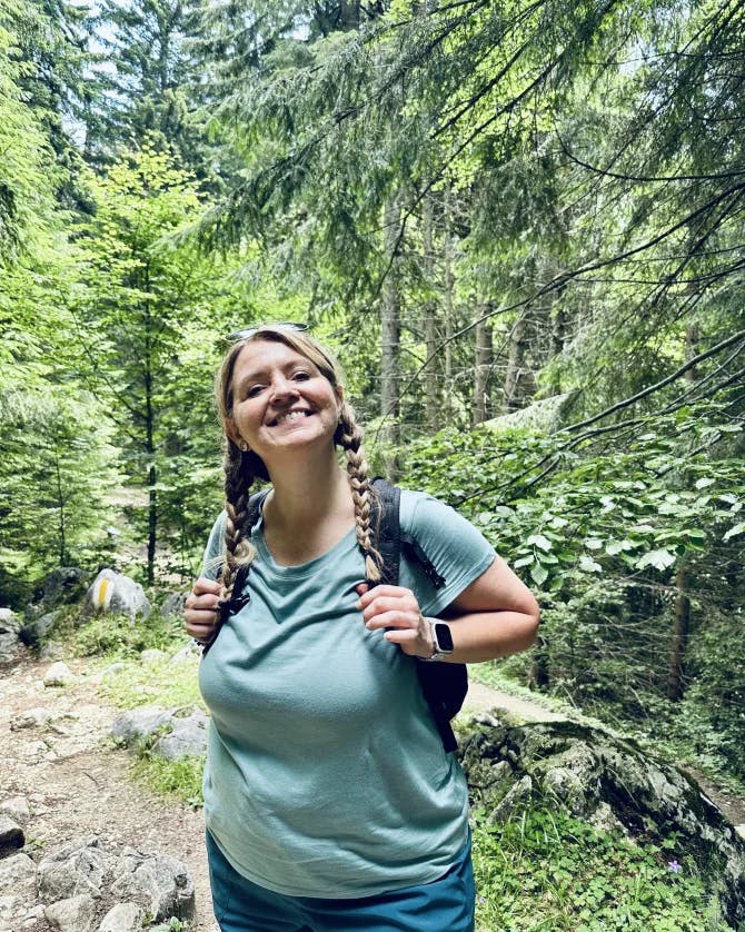 Travel advisor posing in woods 