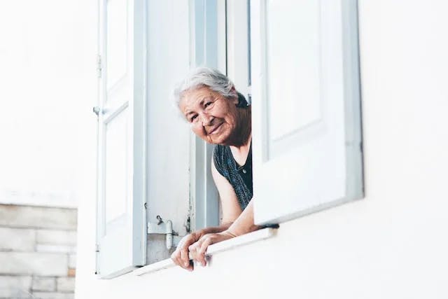 Woman peeing at window