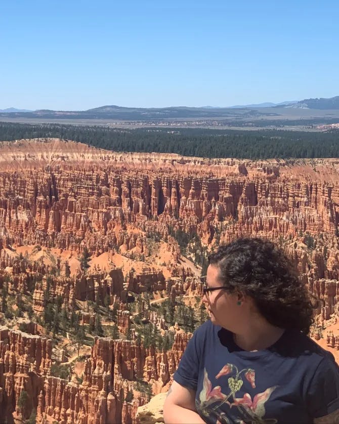 Travel Advisor Amneris Dominguez is overlooking a canyon.