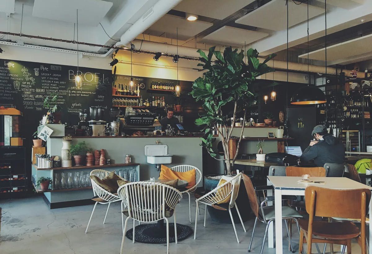 A picture of the interior of a cafe during the daytime.