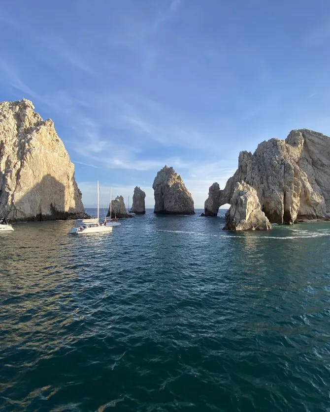 View of sea with rocks and boats