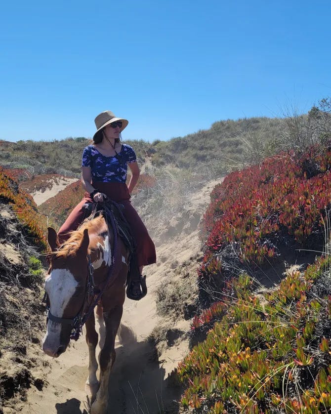 Travel advisor riding a horse