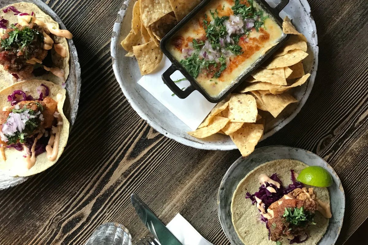 Assorted plates of food on a wooden table