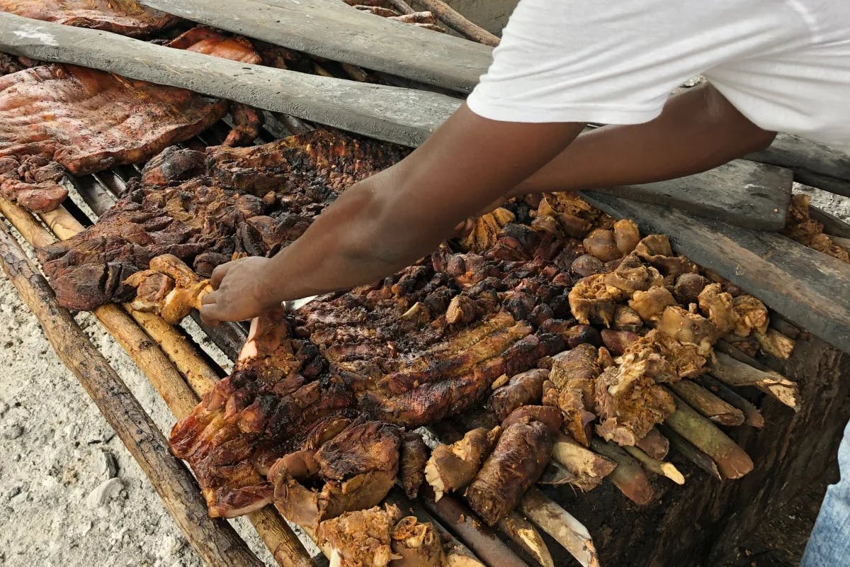 meat-being-grilled-Jamaica-travel-guide