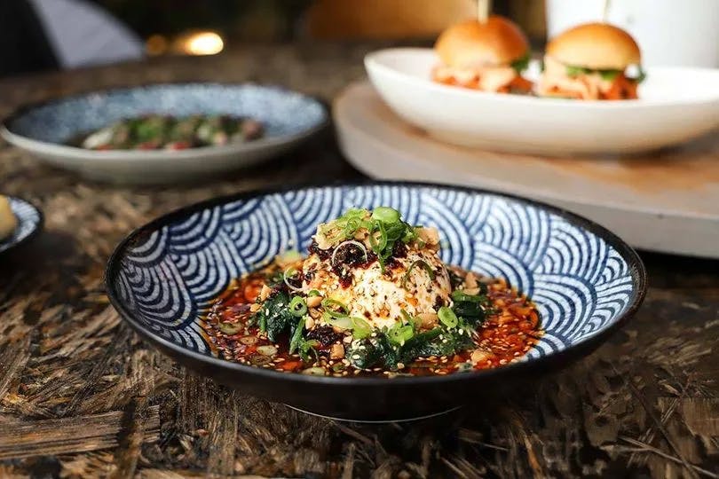 A blue patterned bowl full of food