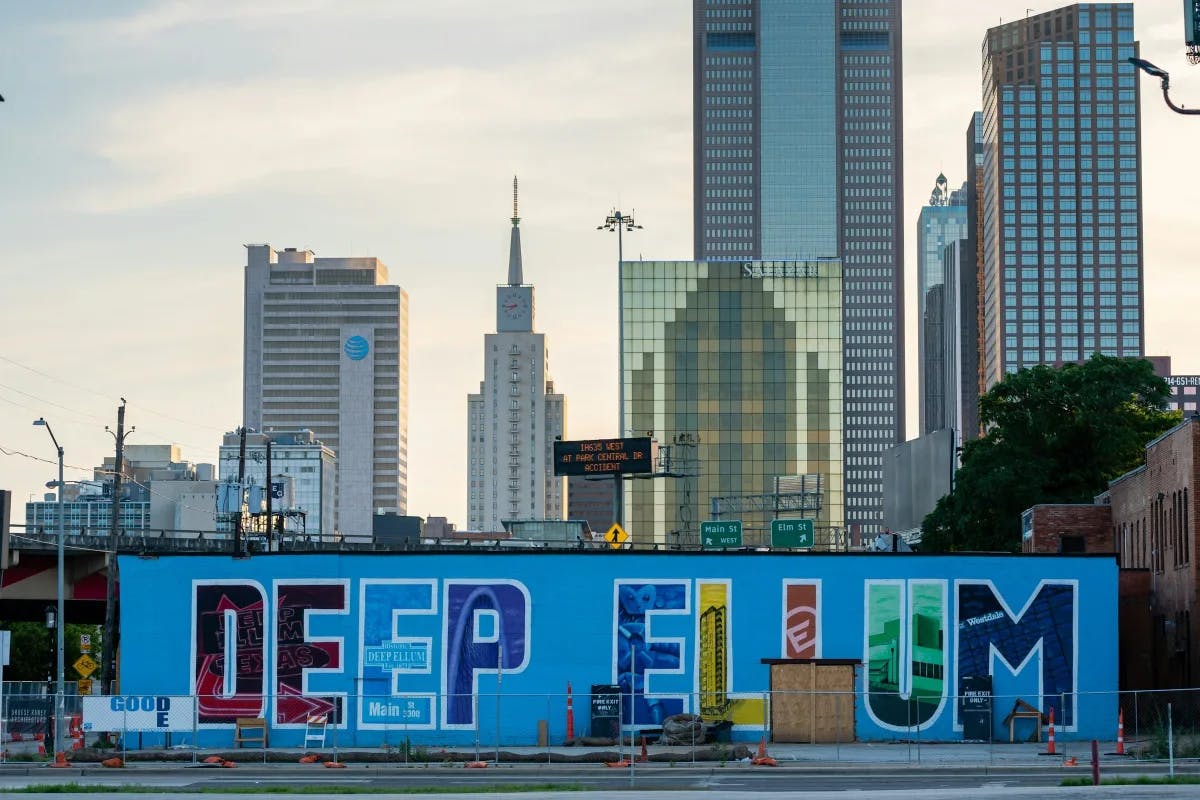 Skyline and a wall mural reading "Deep Elium"