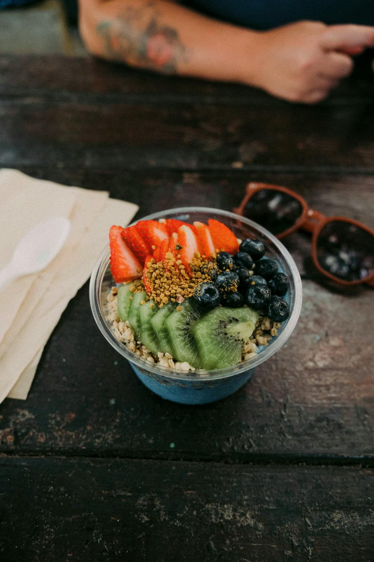 Acai bowl topped with fresh fruits and granola