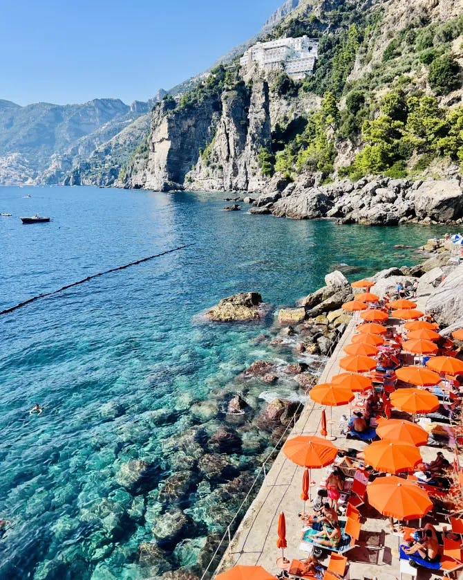 Orange umbrellas set up on the beach