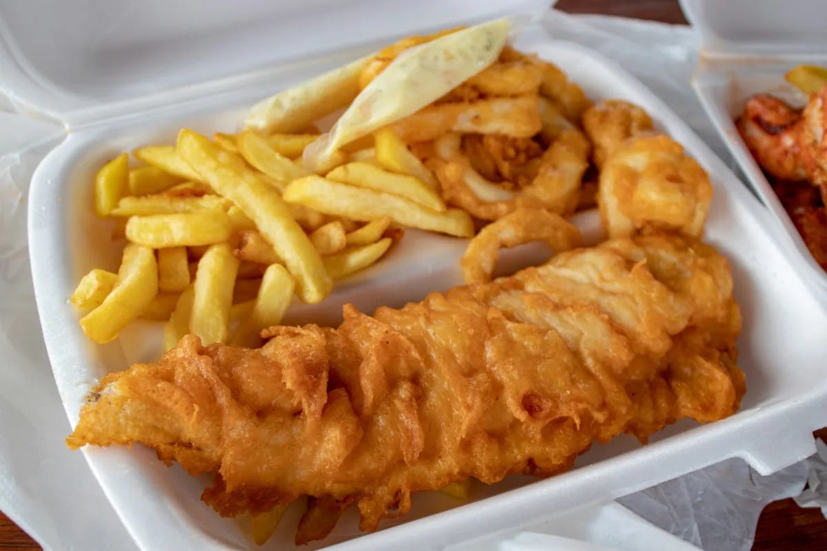 Fish and chips in a to-go box.