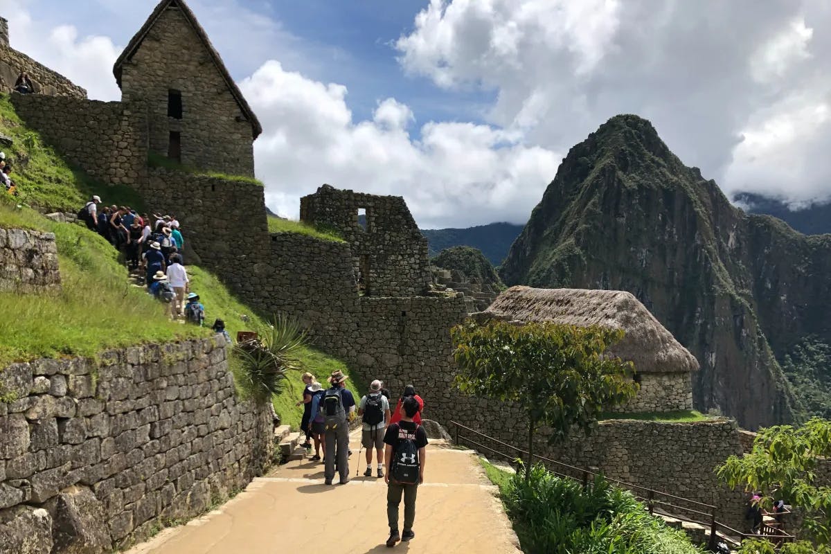 People go on a hike to Machu Picchu.