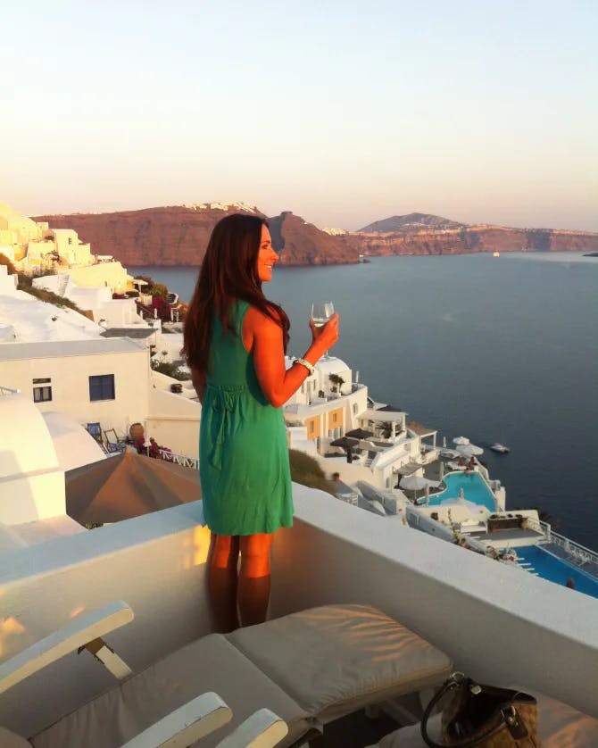 Woman posing in on a seaside building