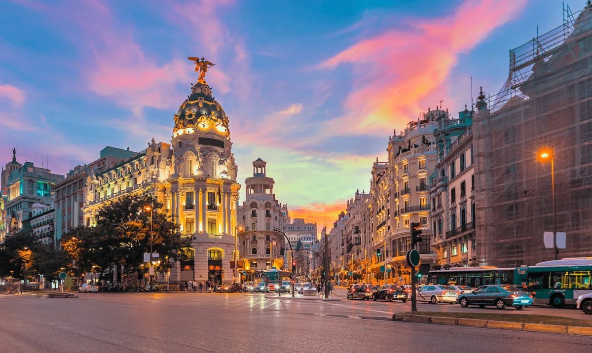 an aerial view of the city of madrid at sundown.