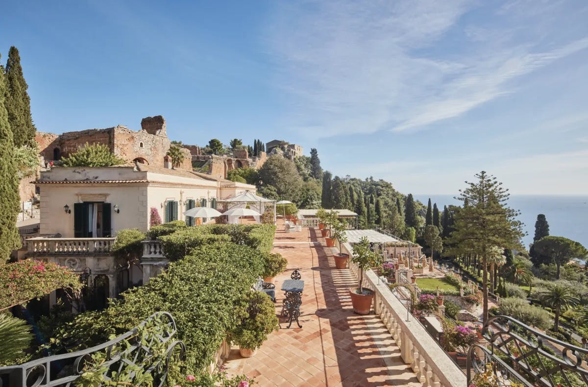 lush gardens surround a luxe Mediterranean estate