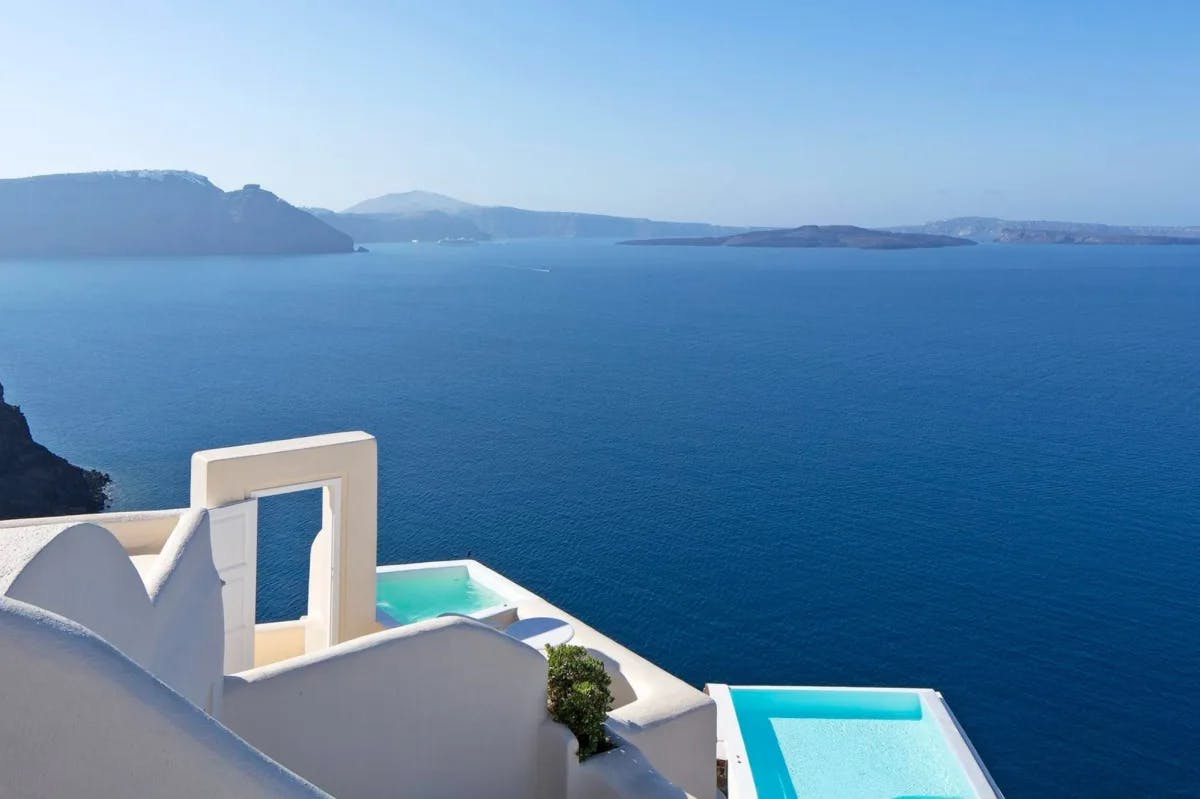 white building with plunge pools overlooking the ocean