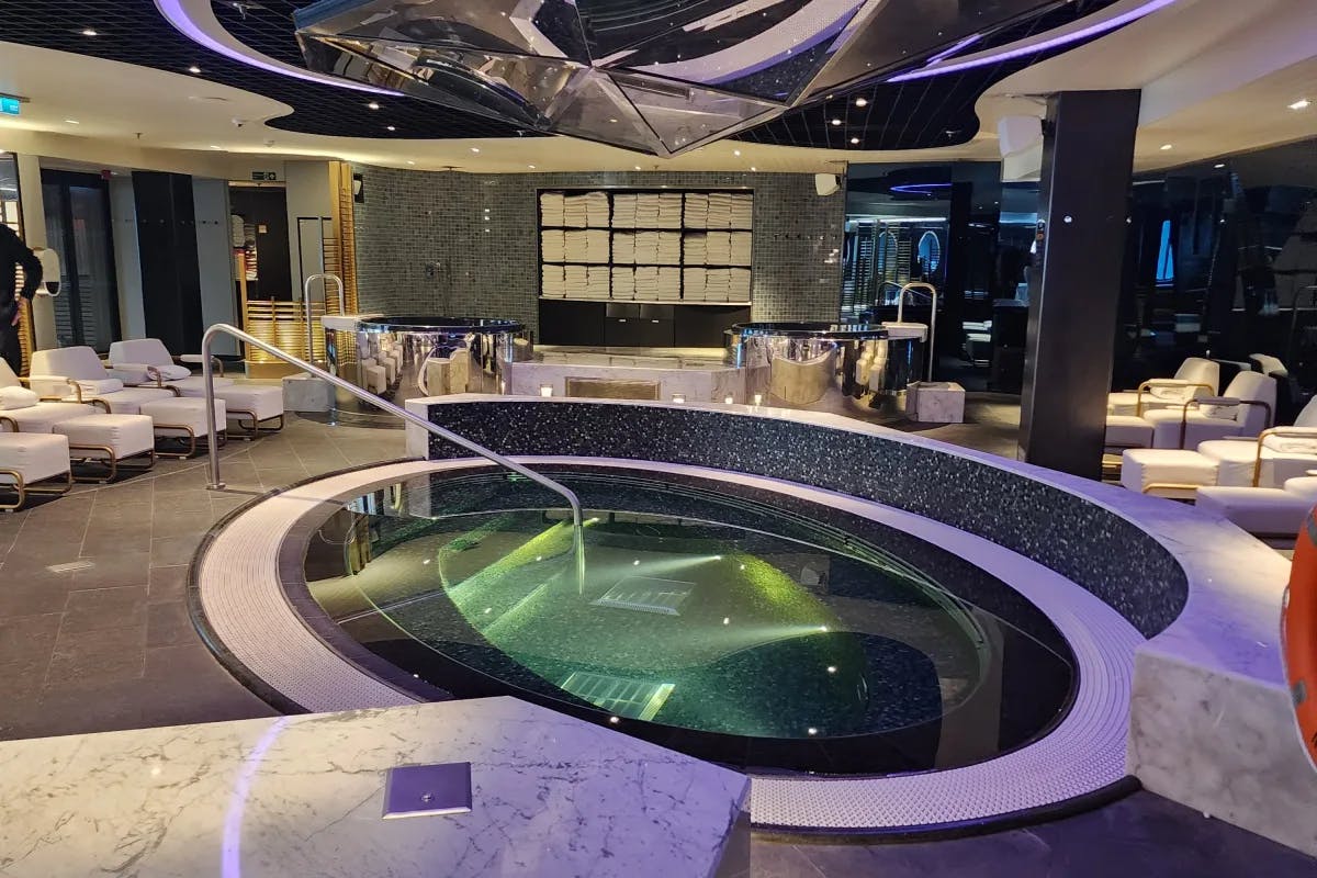 A picture of an indoor pool in a cruise ship.